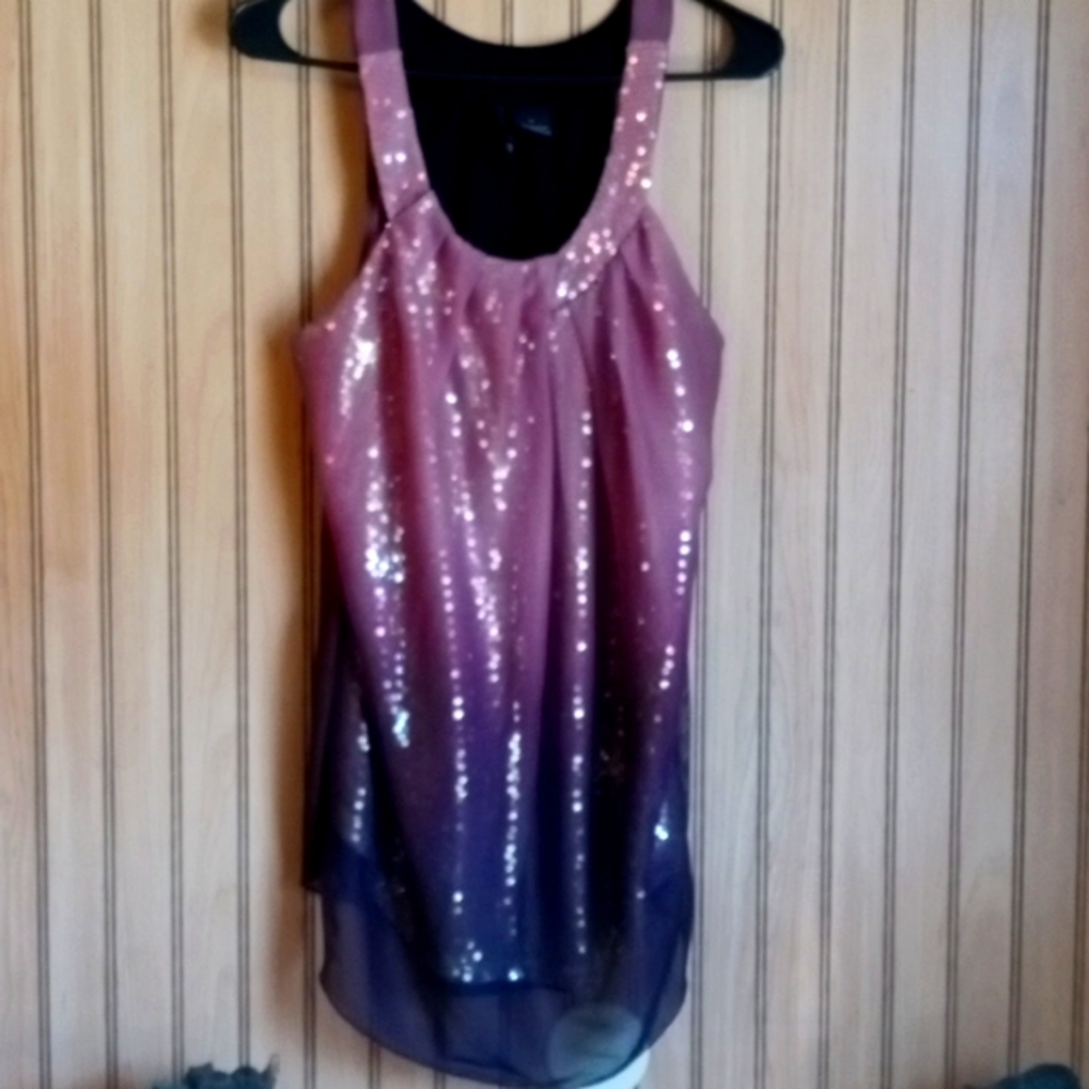 This is a super cute top . Great for any special occasion .